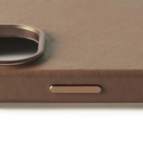 Mujjo Leather Case for iPhone 16 in tan, close-up of textured leather with camera cutout and side button