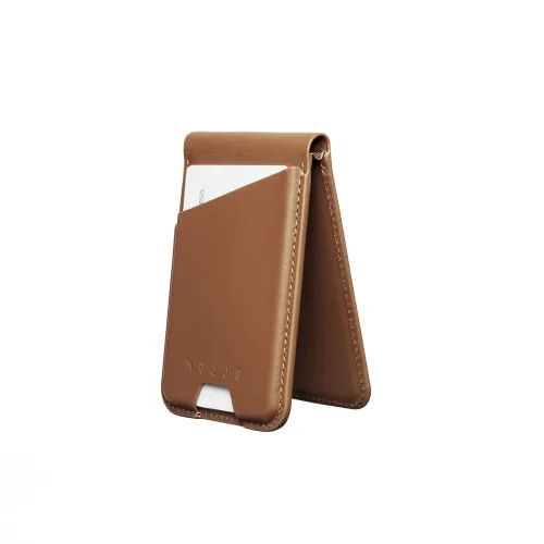 Mujjo wallet stand in tan leather stands in A-shape, with outer card pocket with a card, lower cutout and visible seams all around.