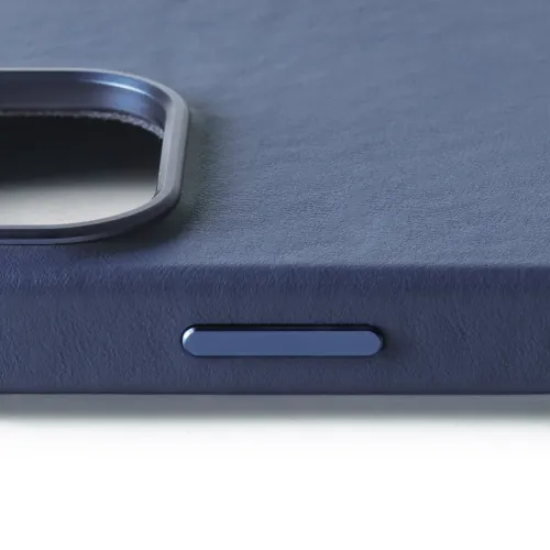Mujjo leather case for iPhone 16 Pro in Monaco Blue, showing textured leather, button cutout and camera edge.